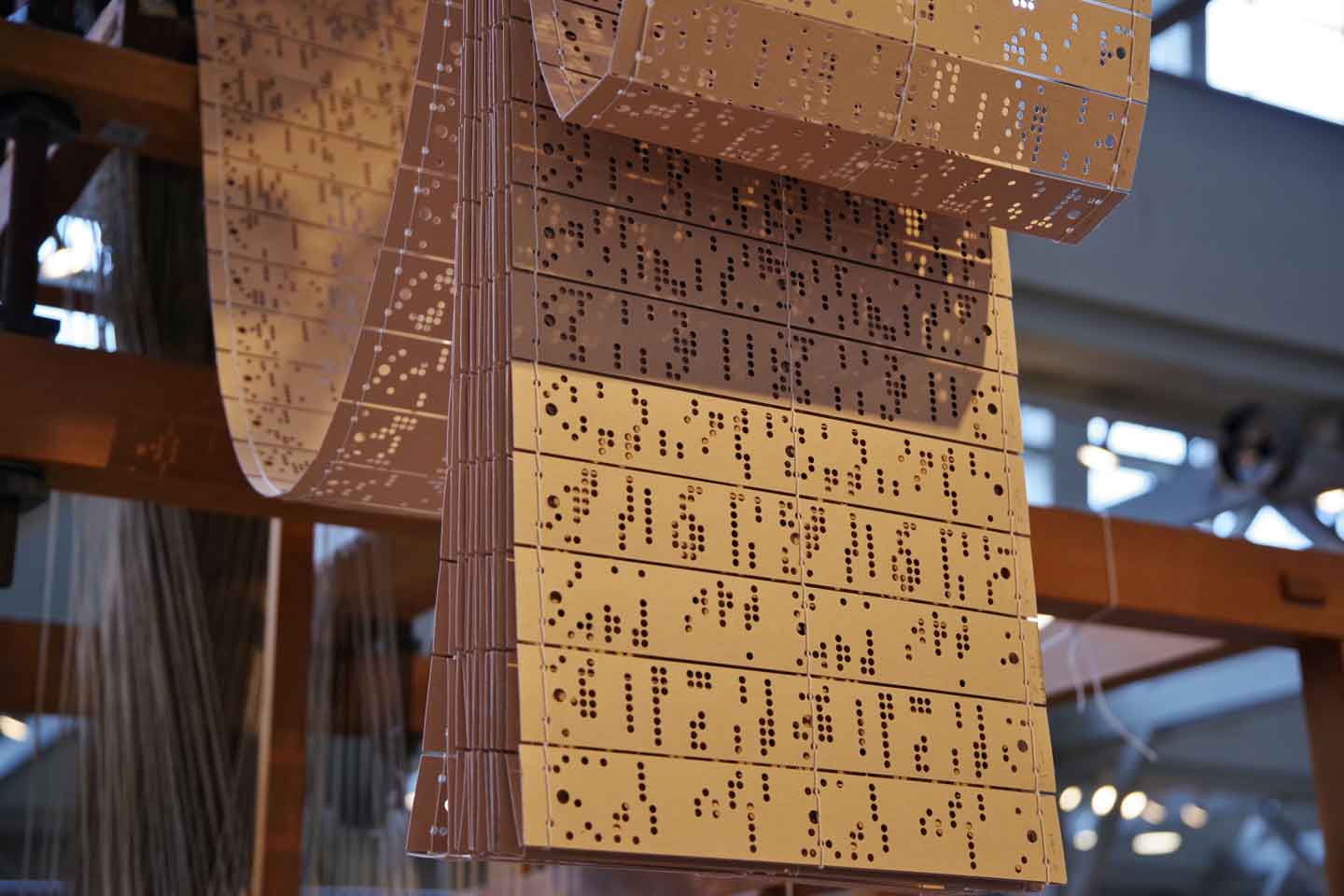 Punched cards used in a Jacquard Programmable Loom.